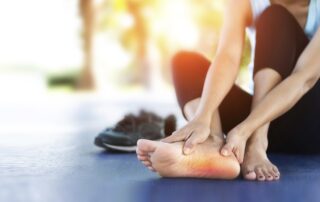 what is plantar fasciitis - woman with foot pain