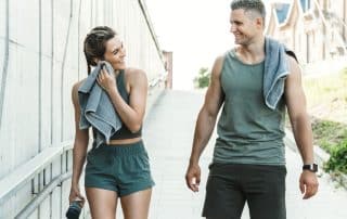 man and woman after workout discussing gender related orthopedic injuries