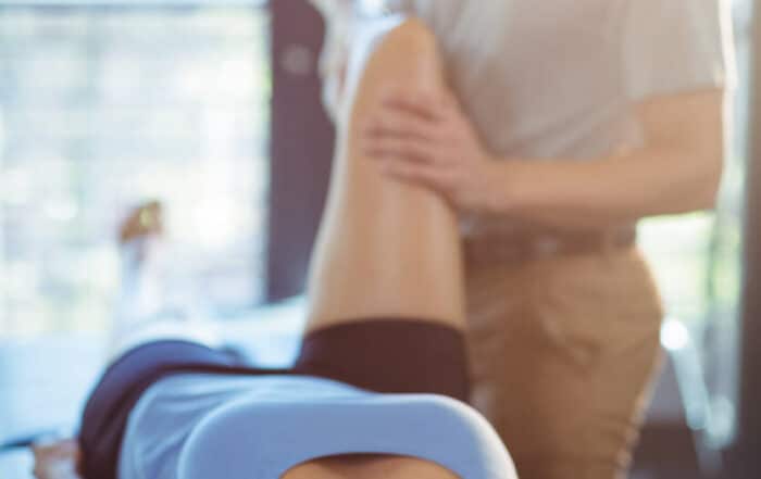 A sport woman receiving orthopedic care for her sports injury.